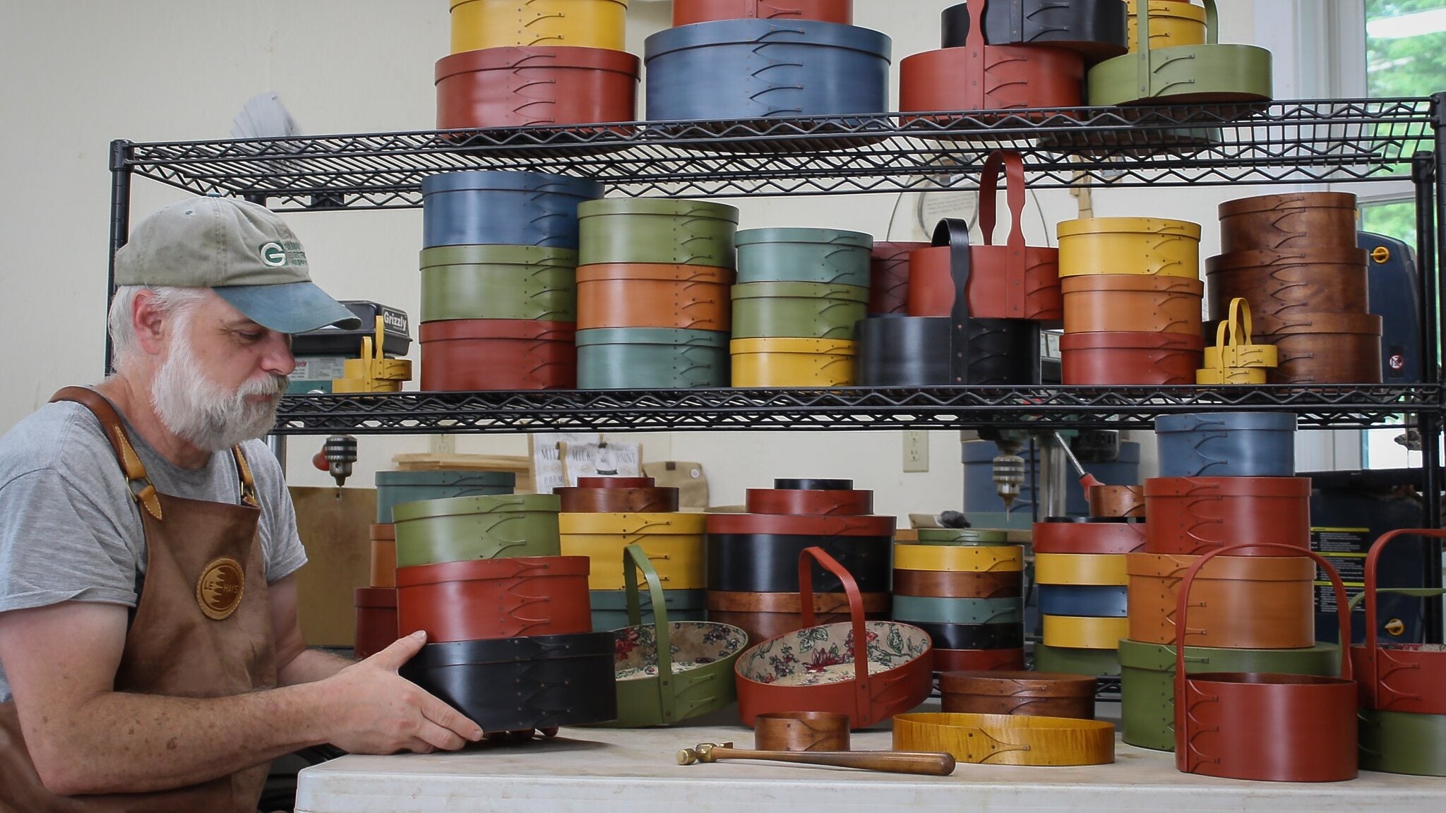 Robert LeHay with handcrafted Shaker boxes in his Maine workshop