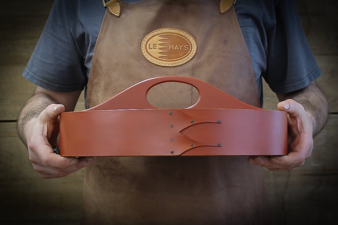 Handcrafted wooden shaker carrier from Maine, featuring a fixed handle, ideal for sewing organization.