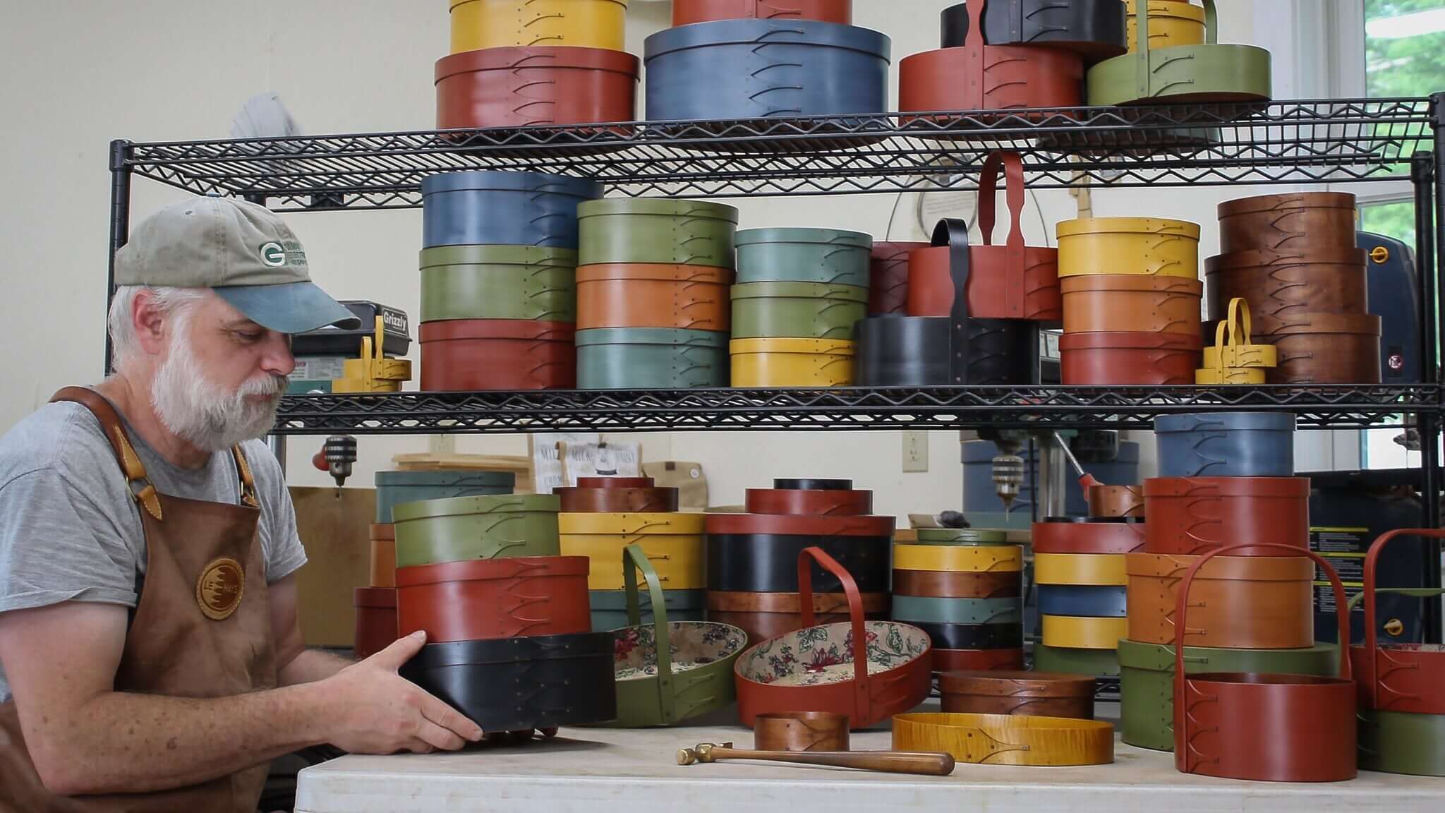 Robert LeHay with handcrafted Shaker boxes in his Maine workshop