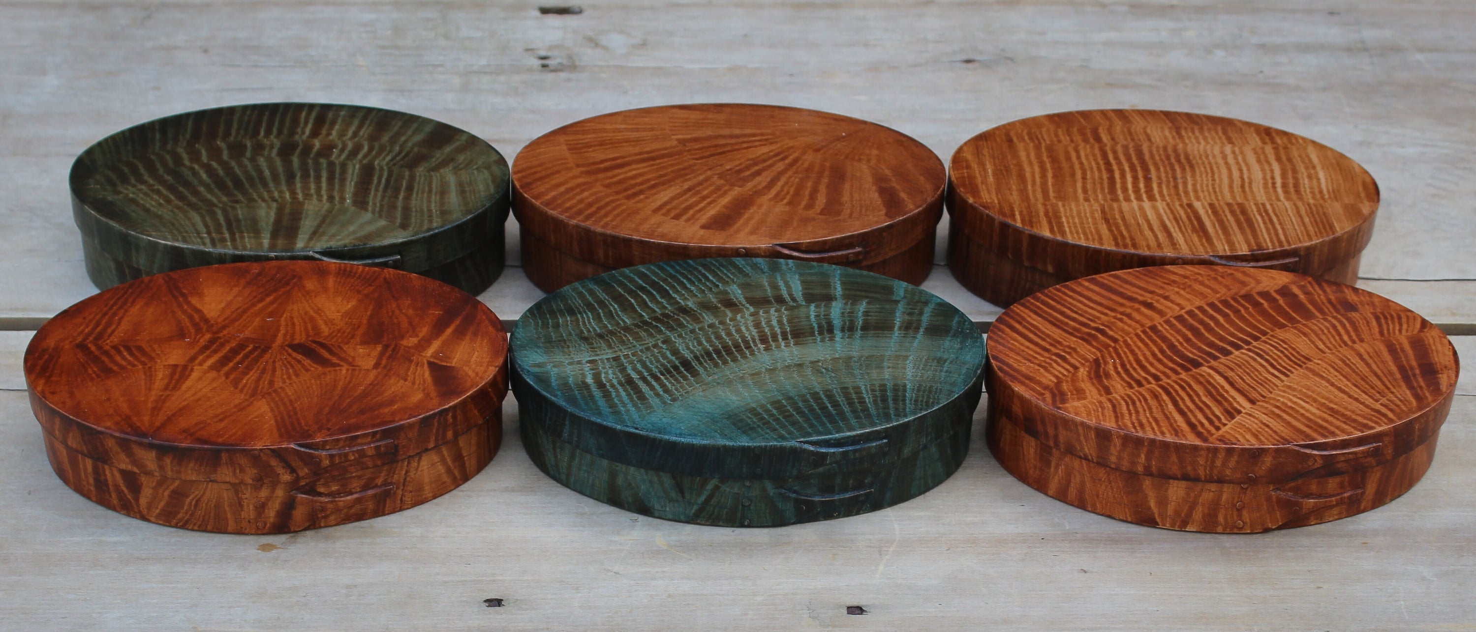 Six painted Shaker oval boxes by Dan Coble — a collaboration with LeHay's Shaker Boxes