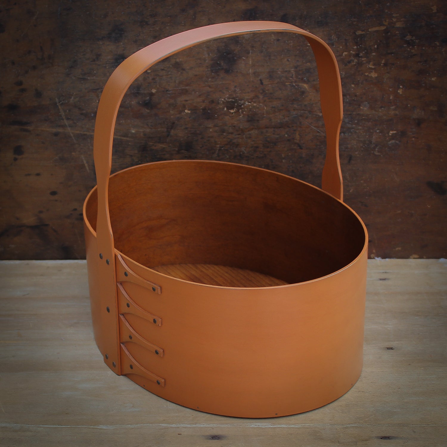 Shaker Carrier, handcrafted in Maine by LeHay’s Shaker Boxes. pumpkin milk paint finish.