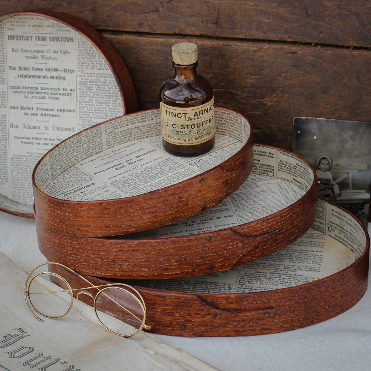 Shaker oval trays with vintage 19th century newspaper lining