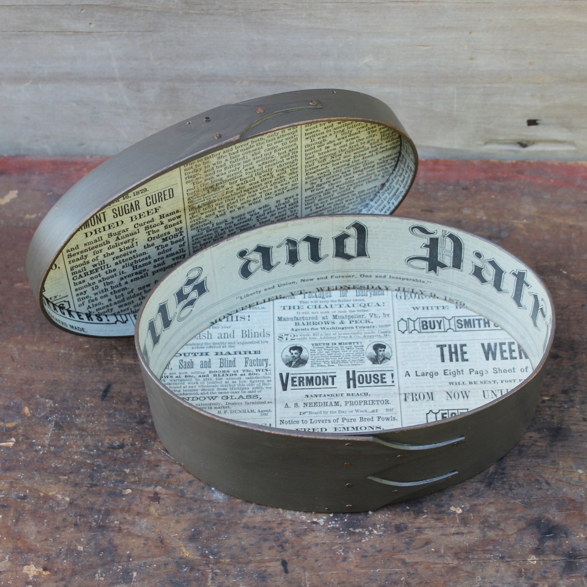 Shaker box with vintage 19th century newspaper lining, grey milk paint finish.