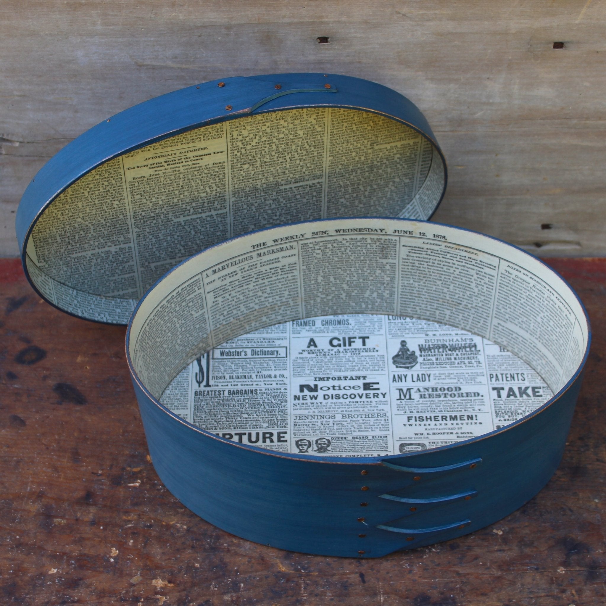 Shaker box with vintage 19th century newspaper lining, blue milk paint finish.