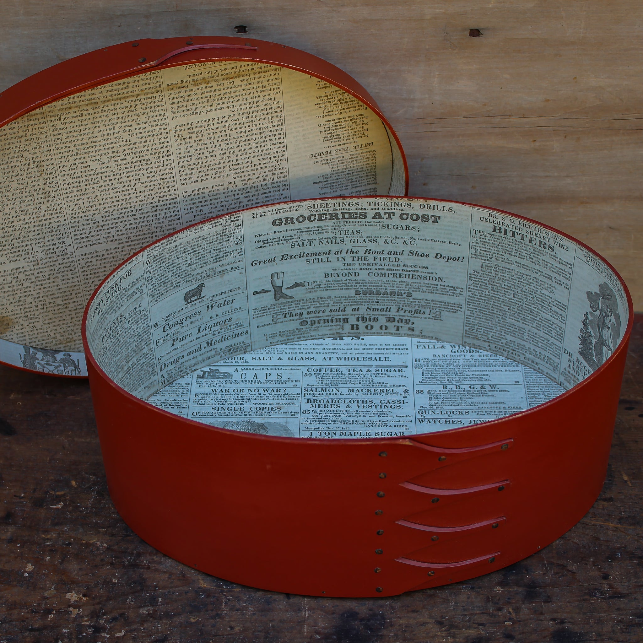 Shaker box with vintage 19th century newspaper lining, red milk paint finish.