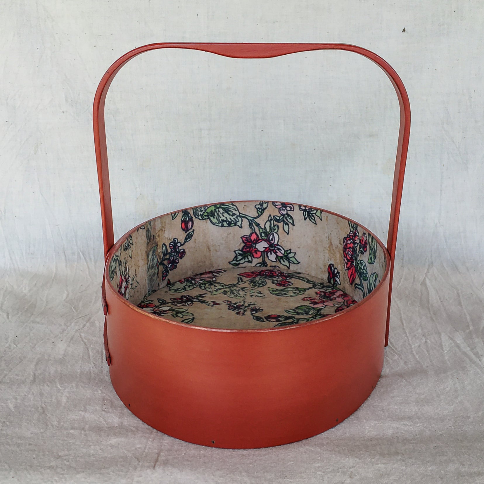 Oval handcrafted Shaker carrier with paper lining, for sewing or storage.