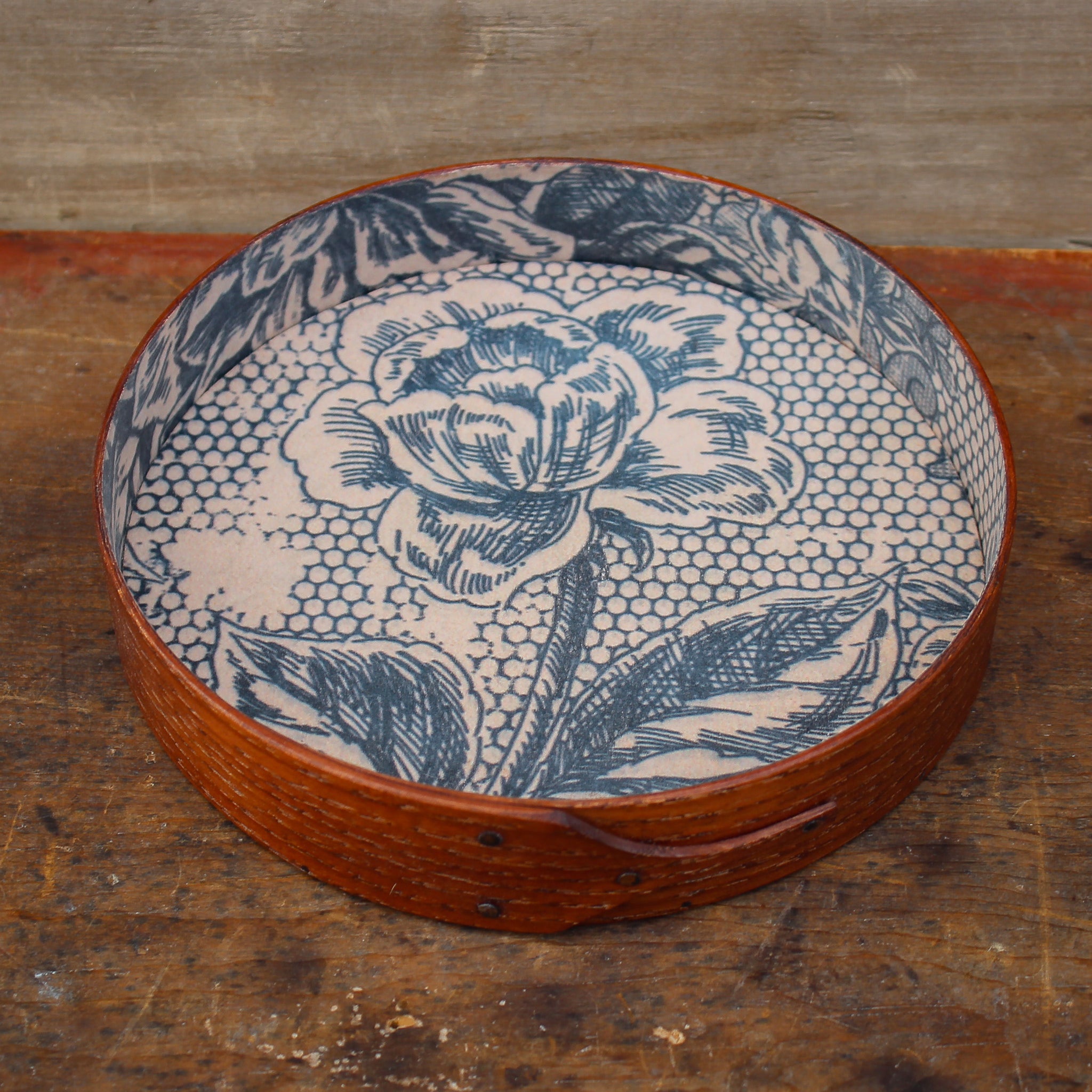 Shaker round tray in an antiqued natural finish and vintage paper lining - handcrafted in Maine by LeHay’s Shaker Boxes