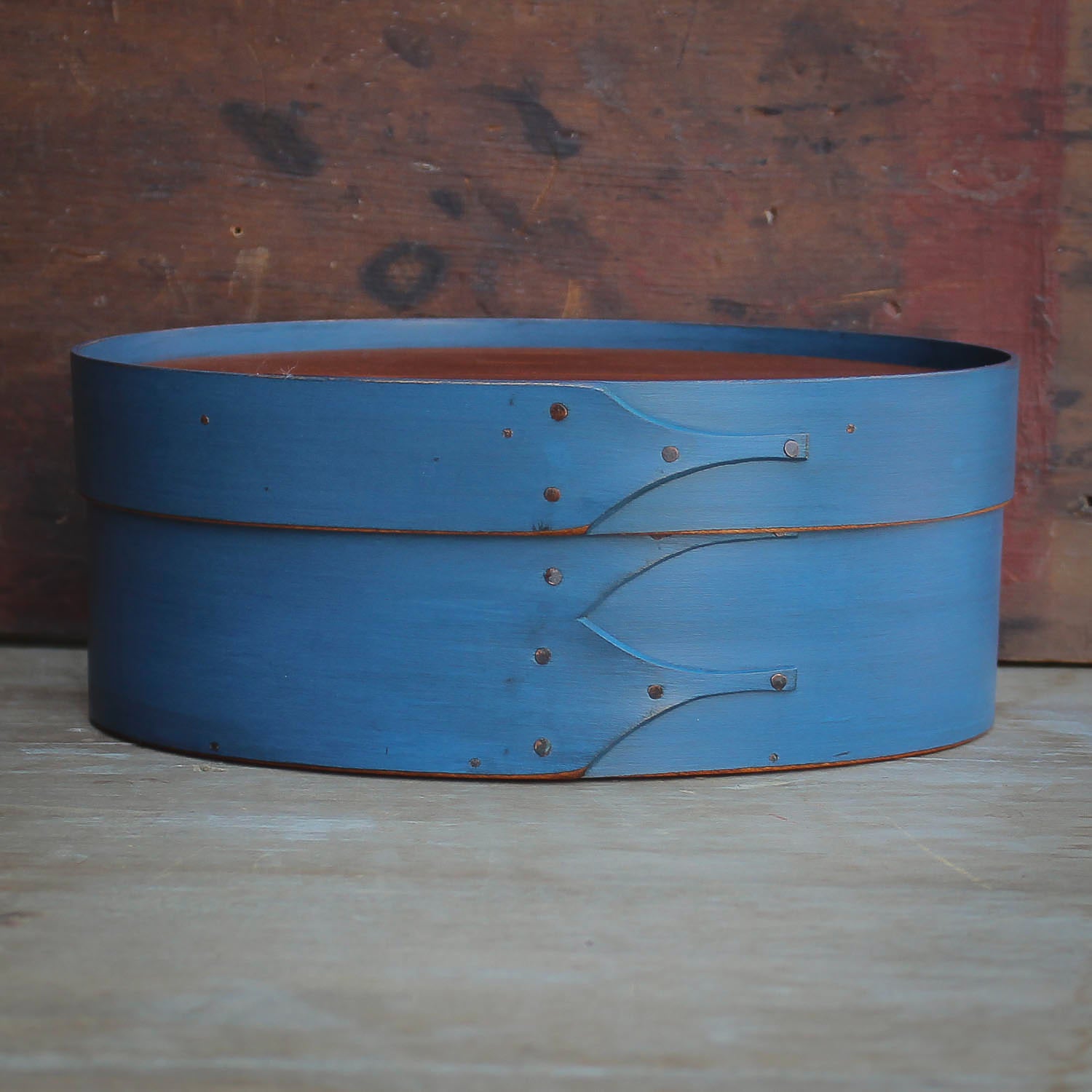 Handcrafted Shaker box in blue, perfect for sewing; oval boxes made in Maine, showcasing traditional craftsmanship.