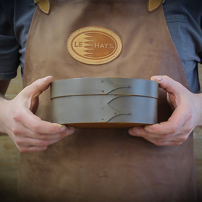 Handcrafted Shaker box in Maine, oval sewing box design, featuring two stacked boxes for storage.