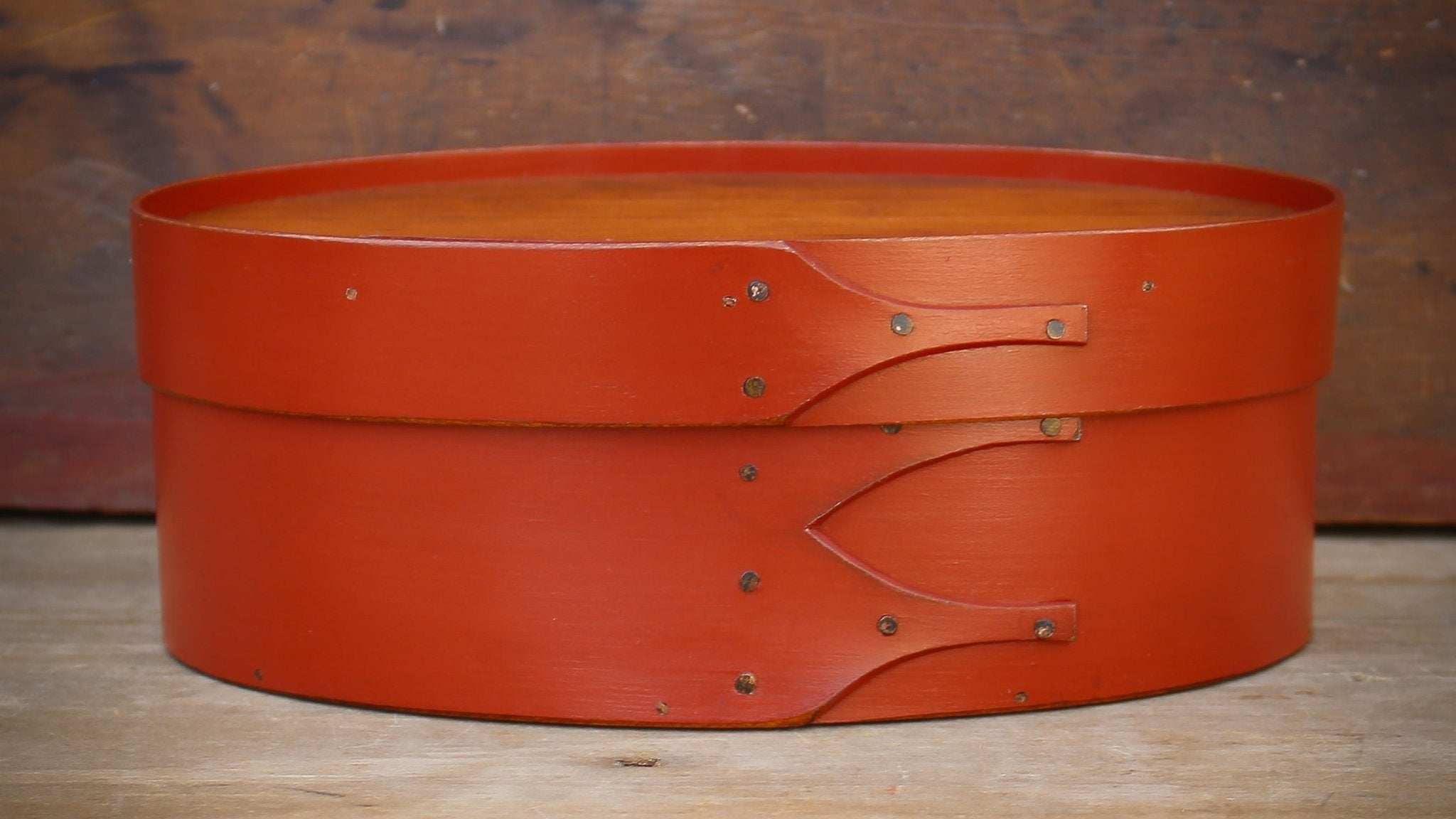 Shaker Oval Box, Size #3, with red finish and recessed lid for displaying finished needlework – handcrafted by LeHay’s Shaker Boxes