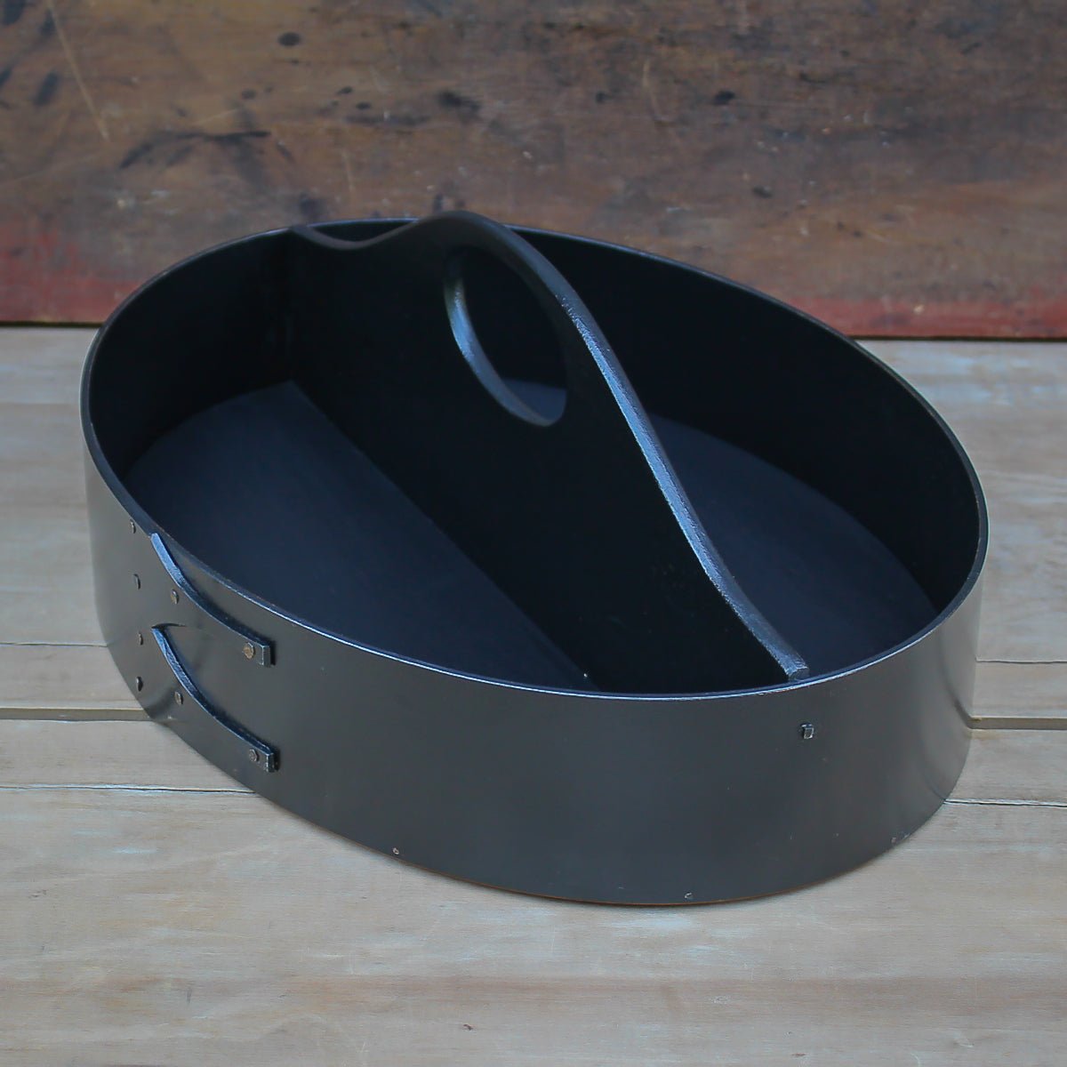 Black oval shaker carrier with fixed handle, handcrafted in Maine, ideal for organizing sewing supplies.