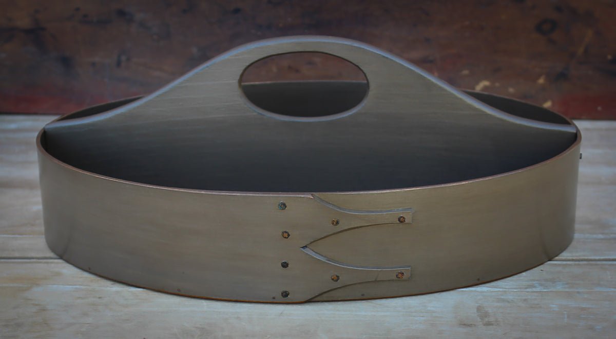 Handcrafted wooden shaker carrier from Maine, oval shape, fixed handle, perfect as a sewing organizer.