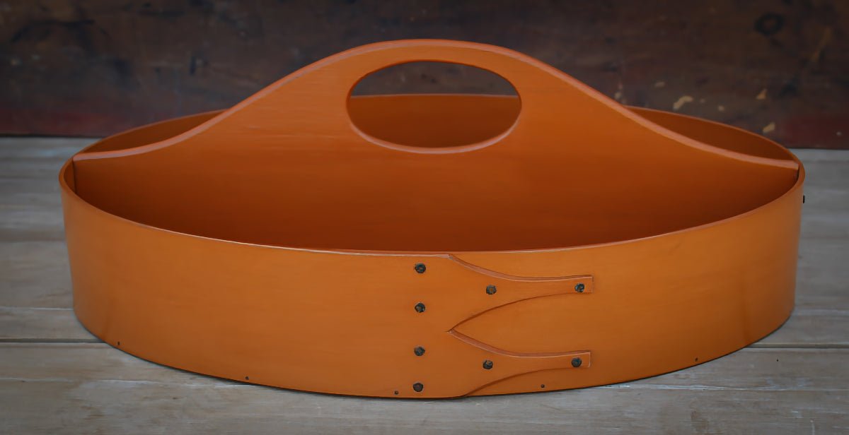 Handcrafted wooden shaker carrier from Maine, featuring a fixed handle, ideal for sewing organization.