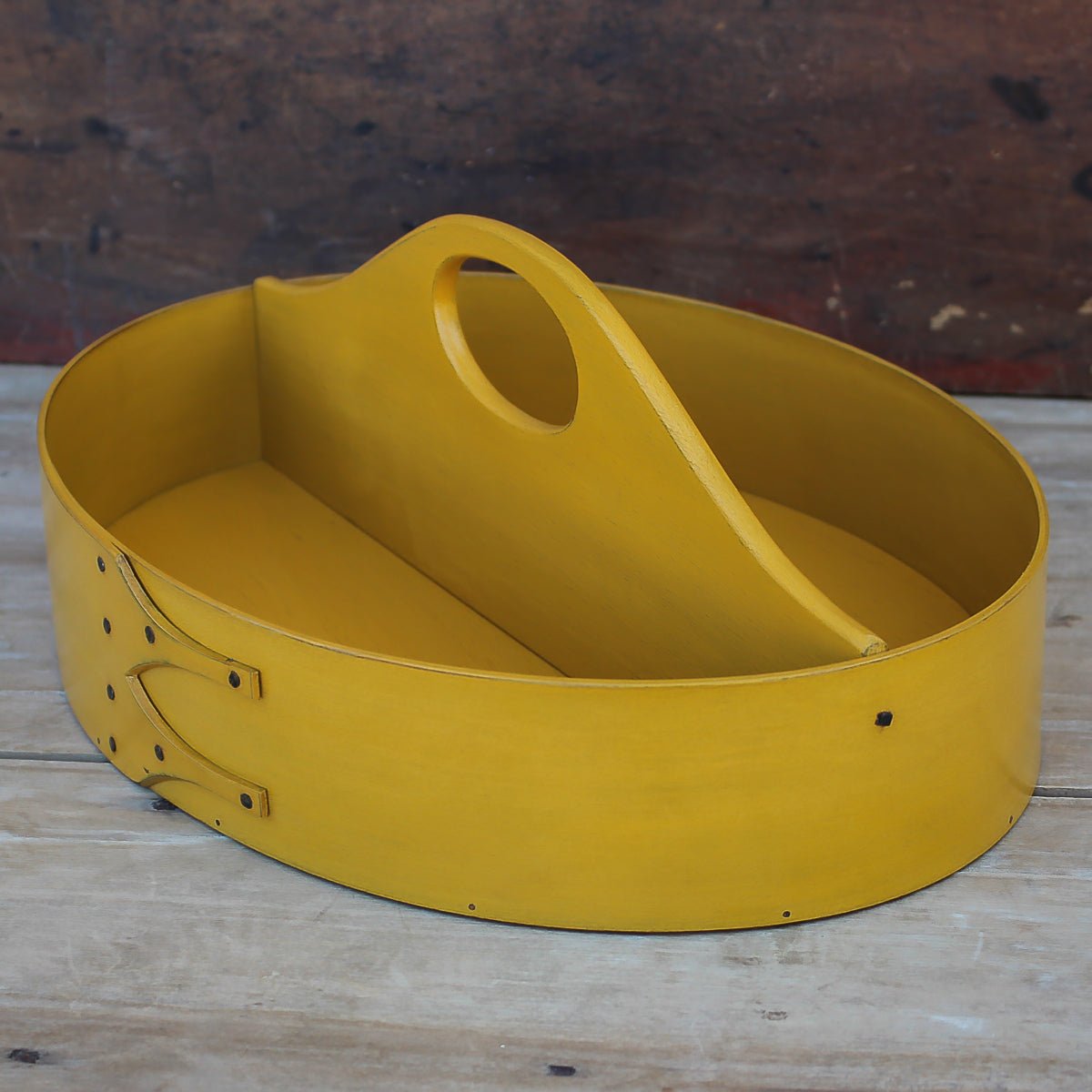 Handcrafted wooden shaker carrier from Maine, featuring a fixed handle, ideal for sewing organization.