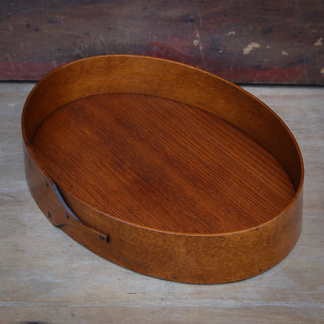 A Size #5 oval stitcher's tray in an antiqued natural finish