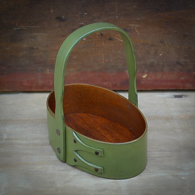 Handcrafted wooden shaker carrier basket from Maine, perfect as a sewing organizer or holiday ornament.