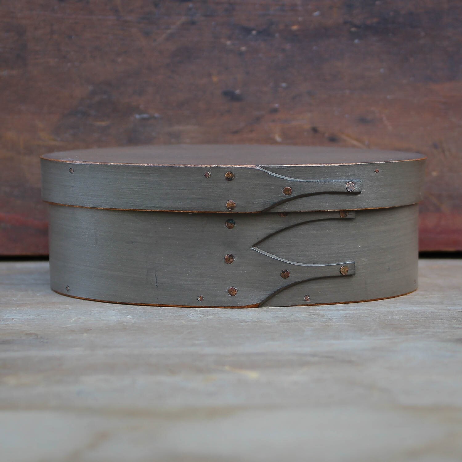Handcrafted wooden oval shaker box from Maine, perfect as a sewing or needlework storage solution.