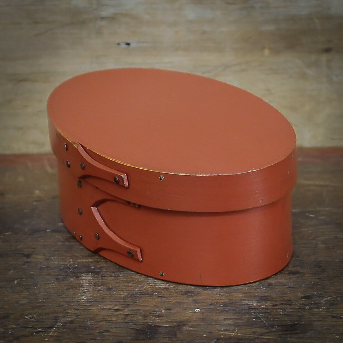 Handcrafted wooden oval shaker box from Maine, perfect for sewing and needlework storage.