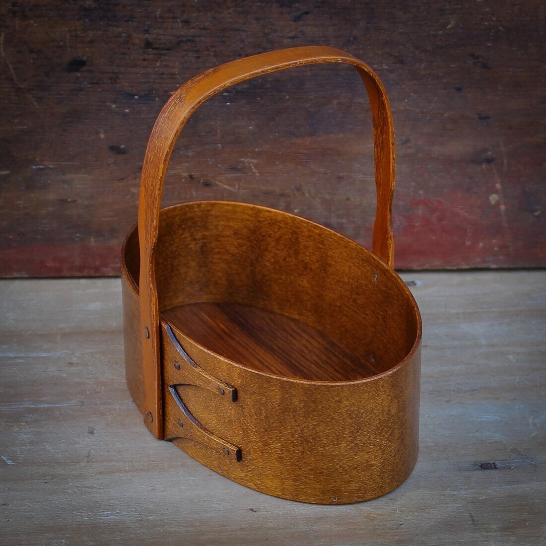 Handcrafted wooden shaker carrier from Maine, ideal as a sewing organizer or for desktop organization.