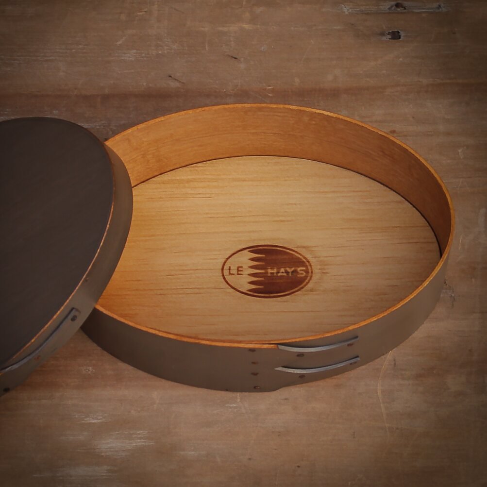 Handcrafted wooden oval shaker box from Maine, perfect for sewing and needlework storage.