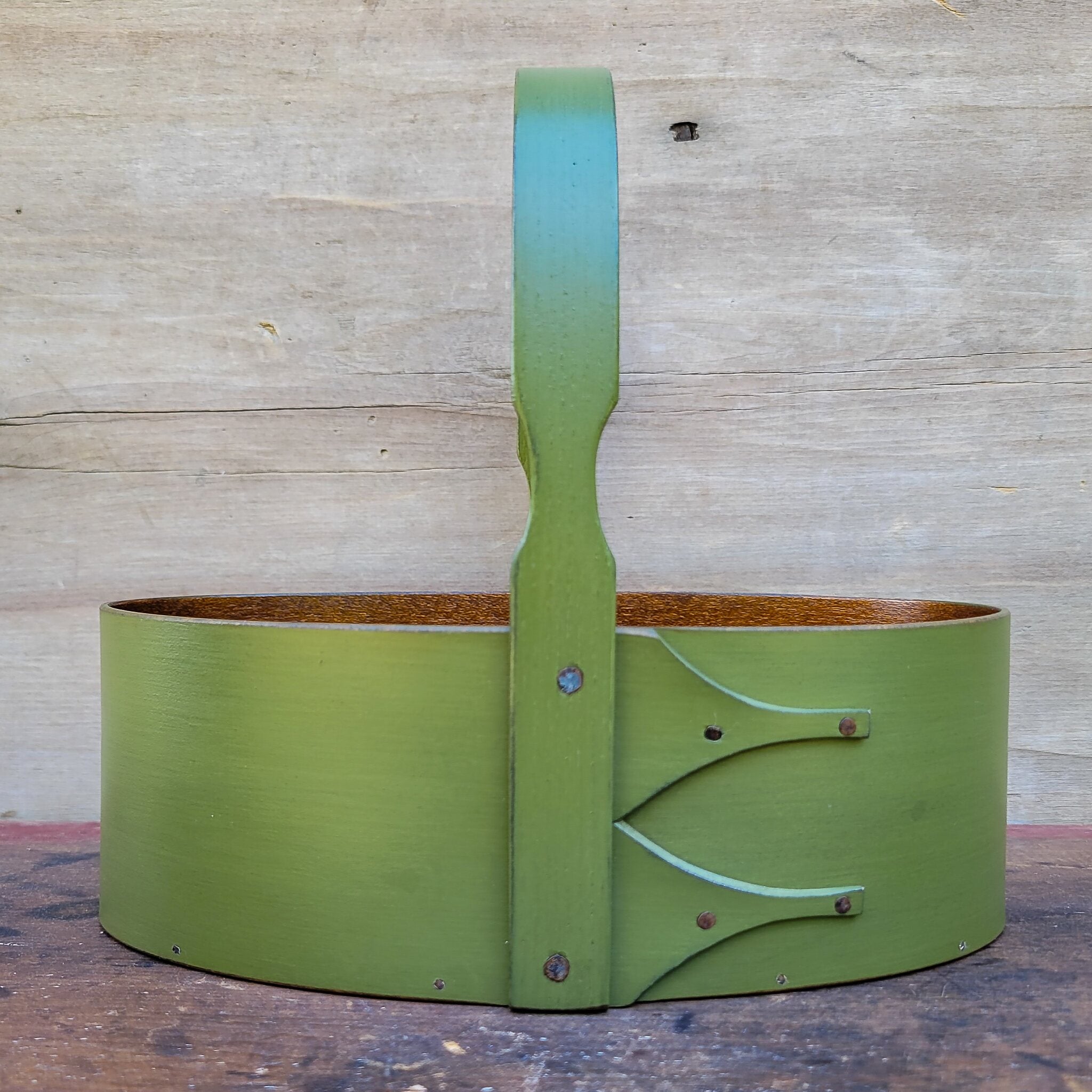 Handcrafted wooden shaker carrier in green, perfect for sewing organization and desktop storage, made in Maine.