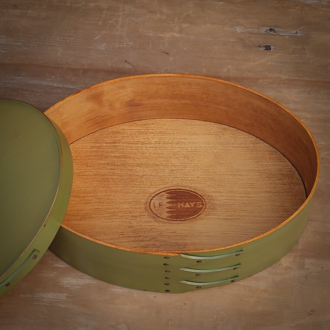 Handcrafted wooden oval shaker box from Maine, perfect for needlework and sewing supplies.