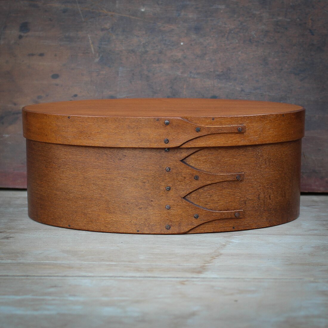 Handcrafted wooden oval shaker box from Maine, perfect for sewing and needlework storage.