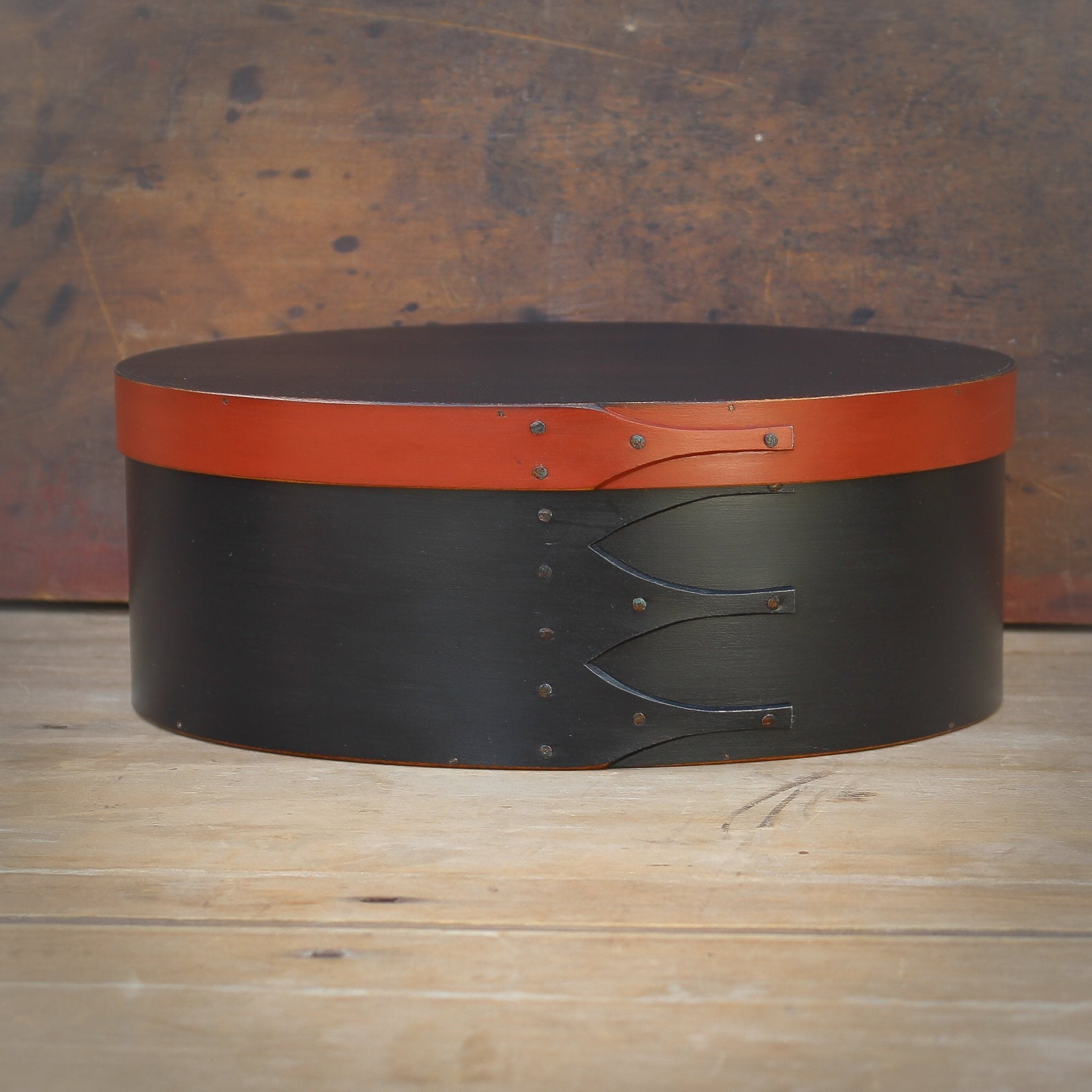 Handcrafted wooden oval Shaker box from Maine, perfect for sewing and needlework storage.