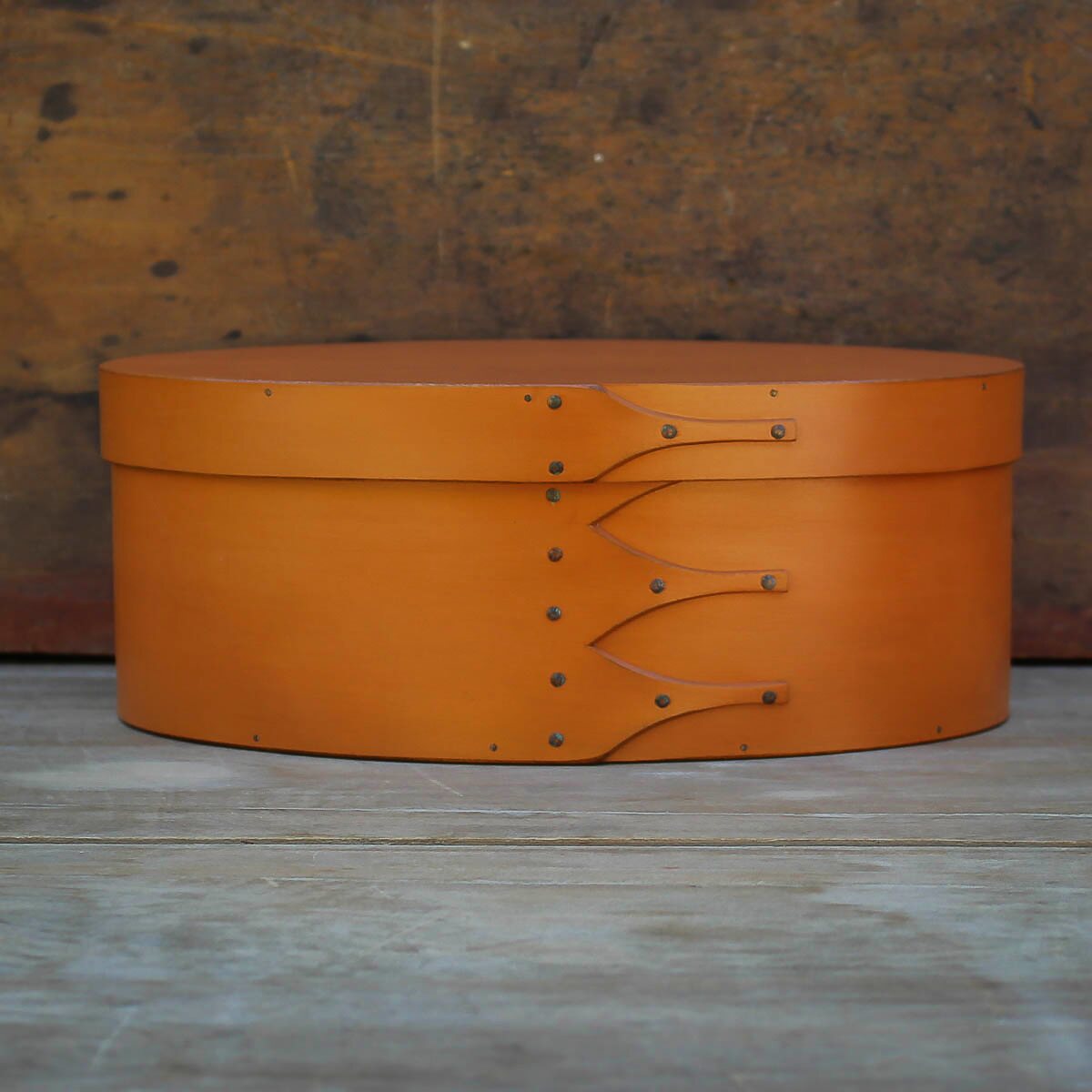 Handcrafted wooden oval shaker box from Maine, perfect for sewing and needlework storage.
