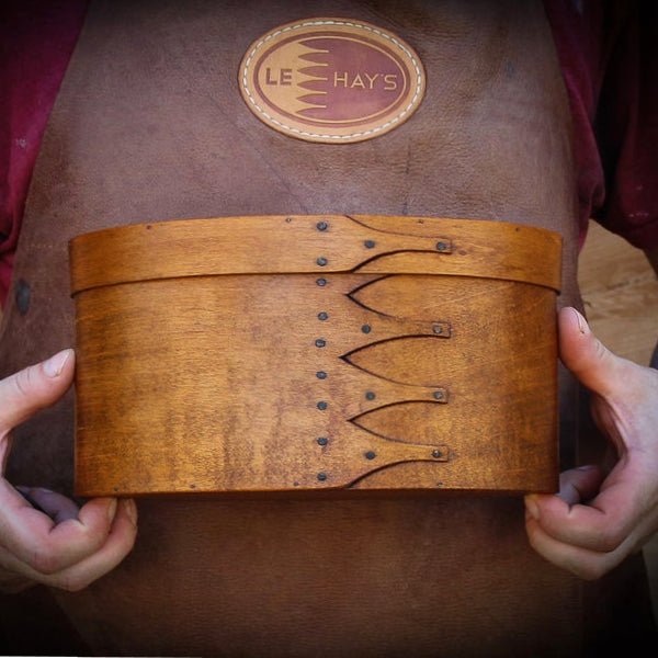 Handcrafted wooden Shaker box from Maine, perfect as a sewing box for needlework enthusiasts.