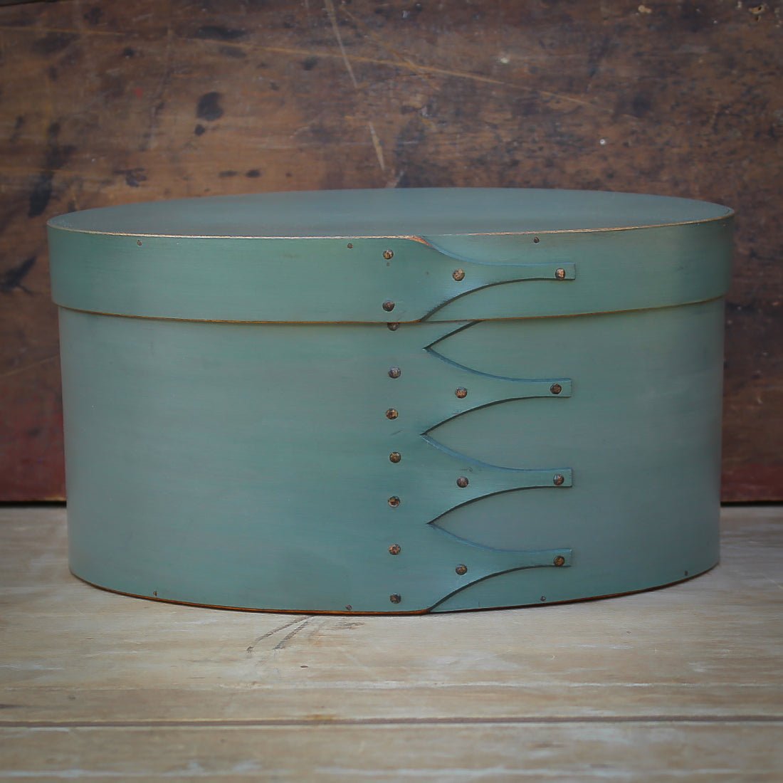 Handcrafted wooden oval Shaker box in green, perfect for sewing and needlework, made in Maine.