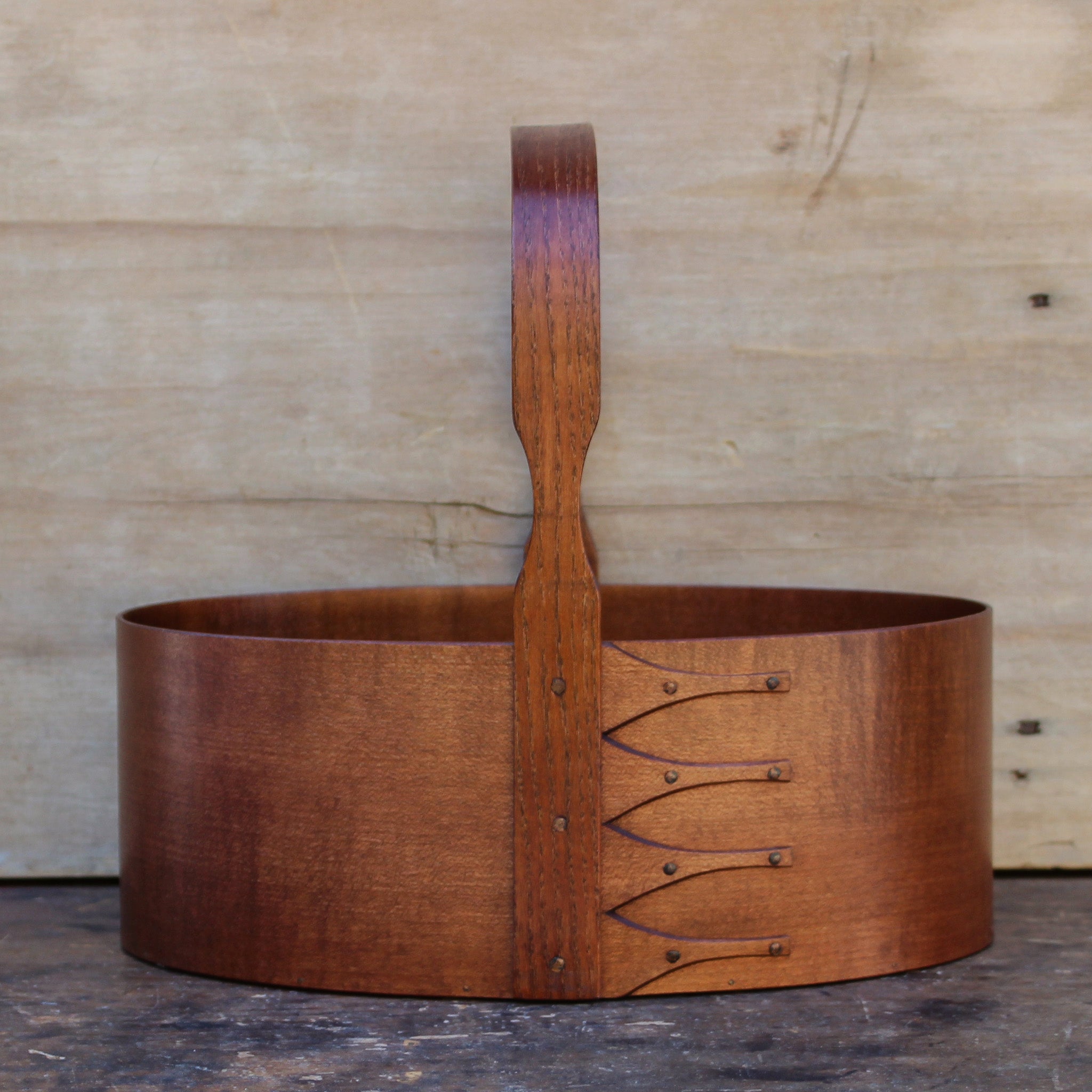 Handcrafted wooden Shaker carrier basket from Maine, perfect for sewing and desktop organization.