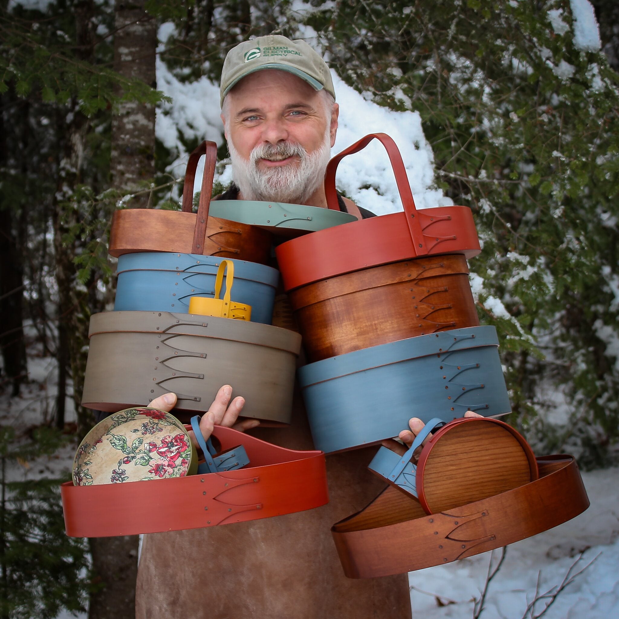 Handcrafted shaker boxes in various colors, made in Maine for sewing and needlework display.