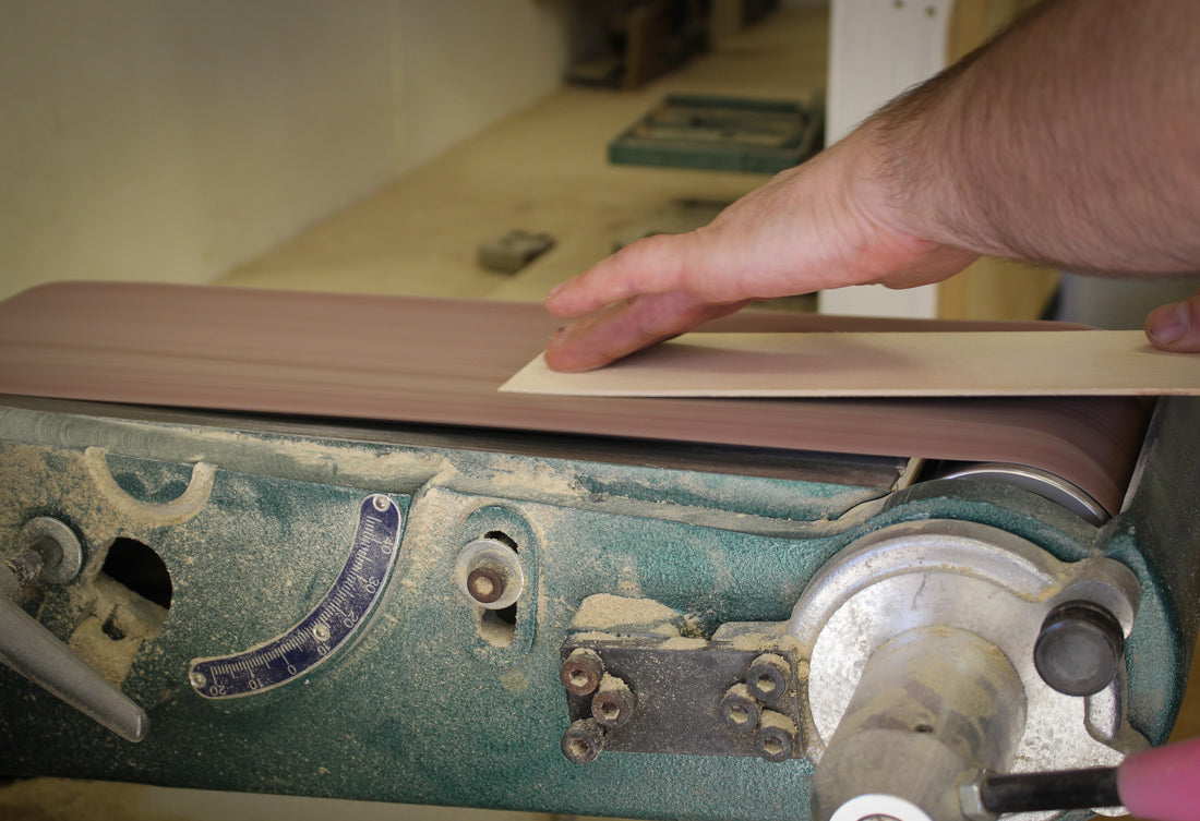 Feathering a band end at the sander so the wrap lies flush