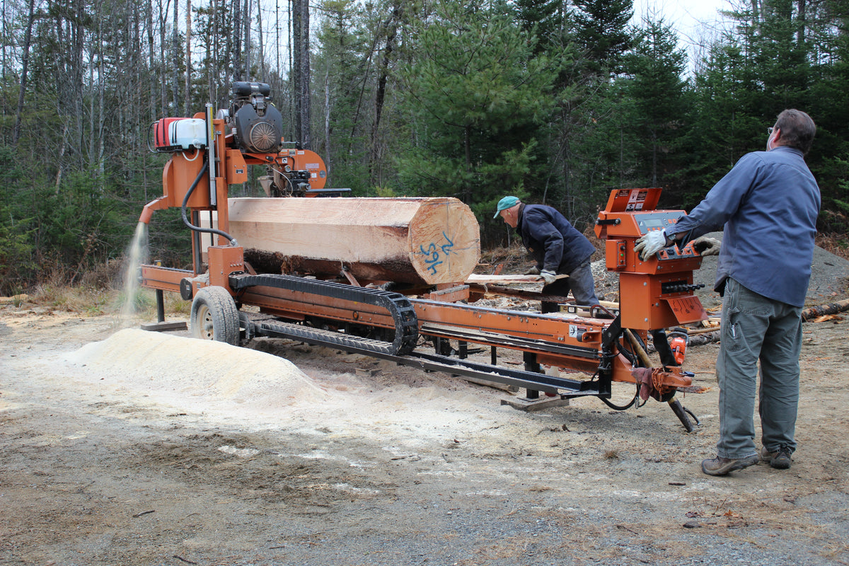Logs being milled on the property in Embden