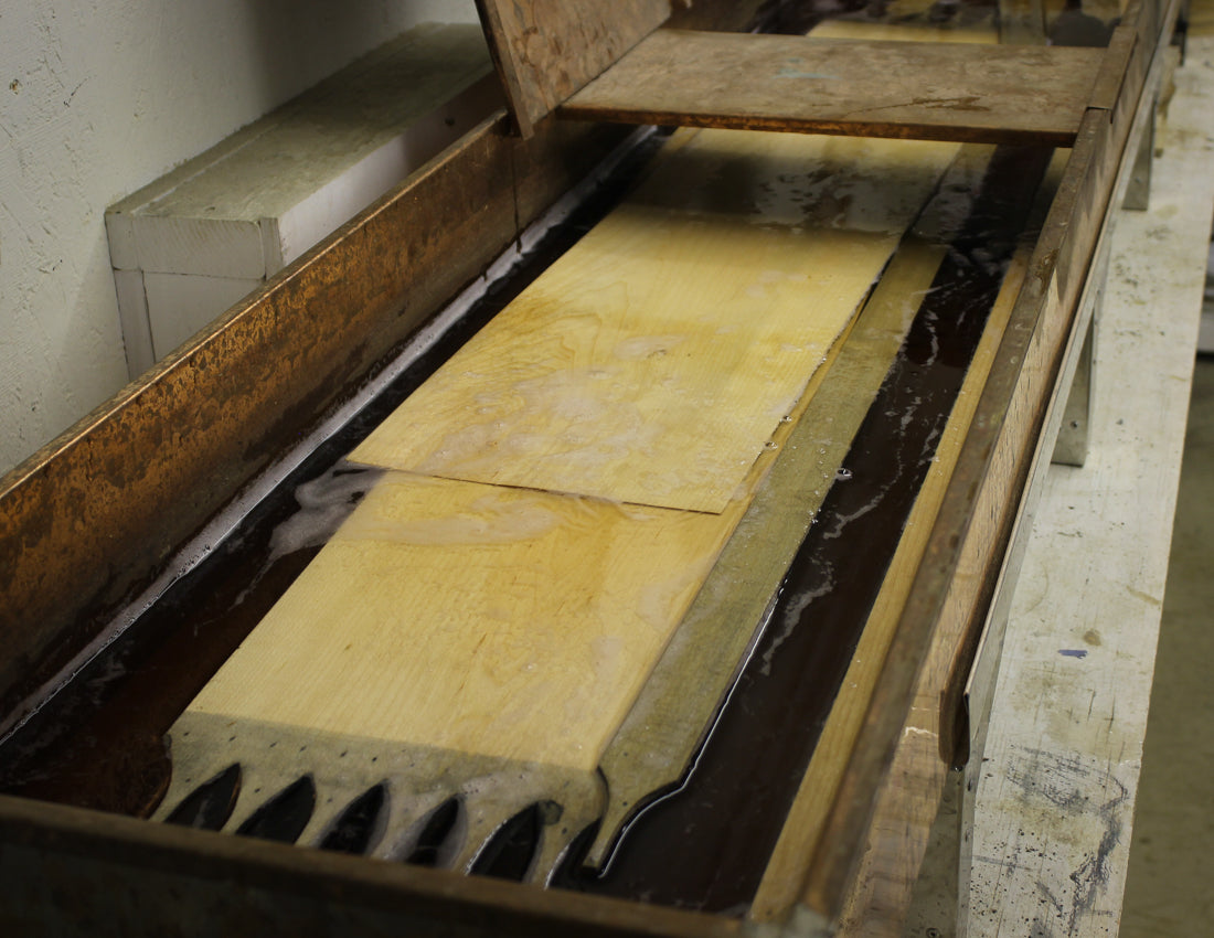Bands soaking in the hot-water tray before bending