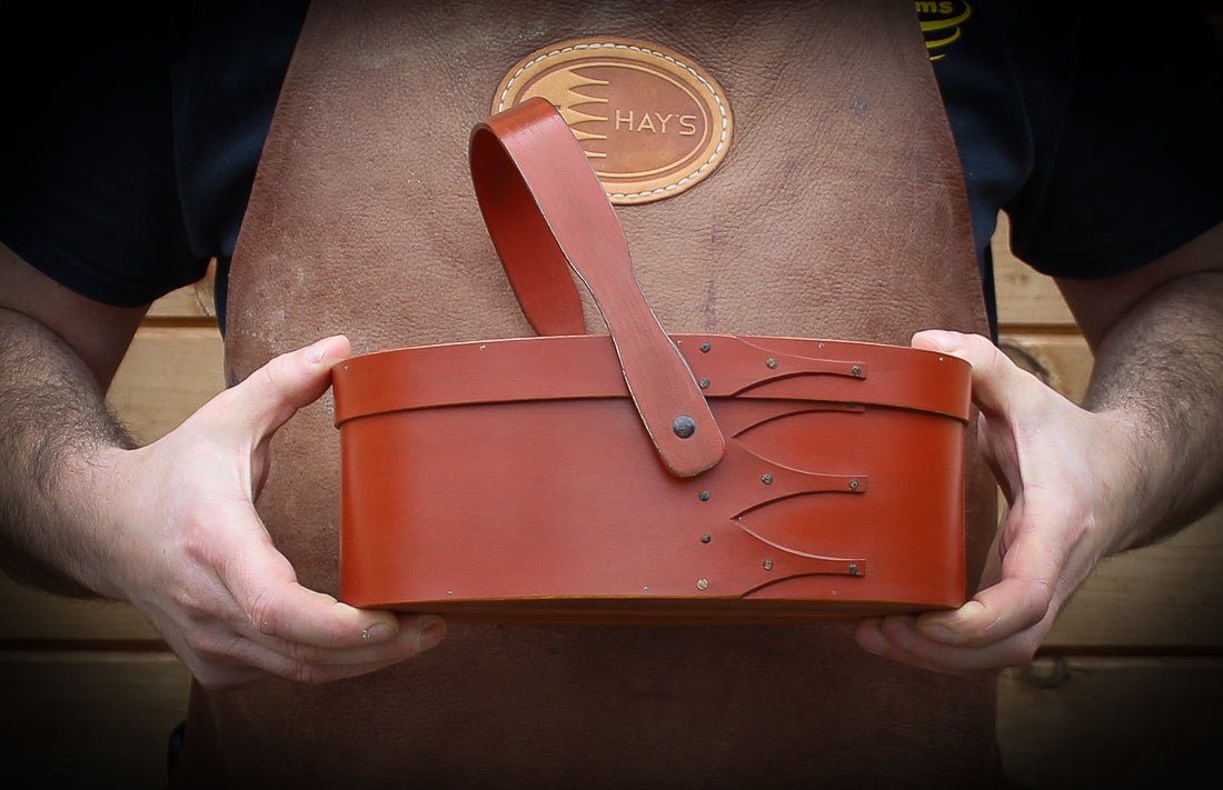 Shaker Style Swing Handle Carrier, LeHays Shaker Boxes, Handcrafted in Maine, Robert LeHay Holding Carrier.